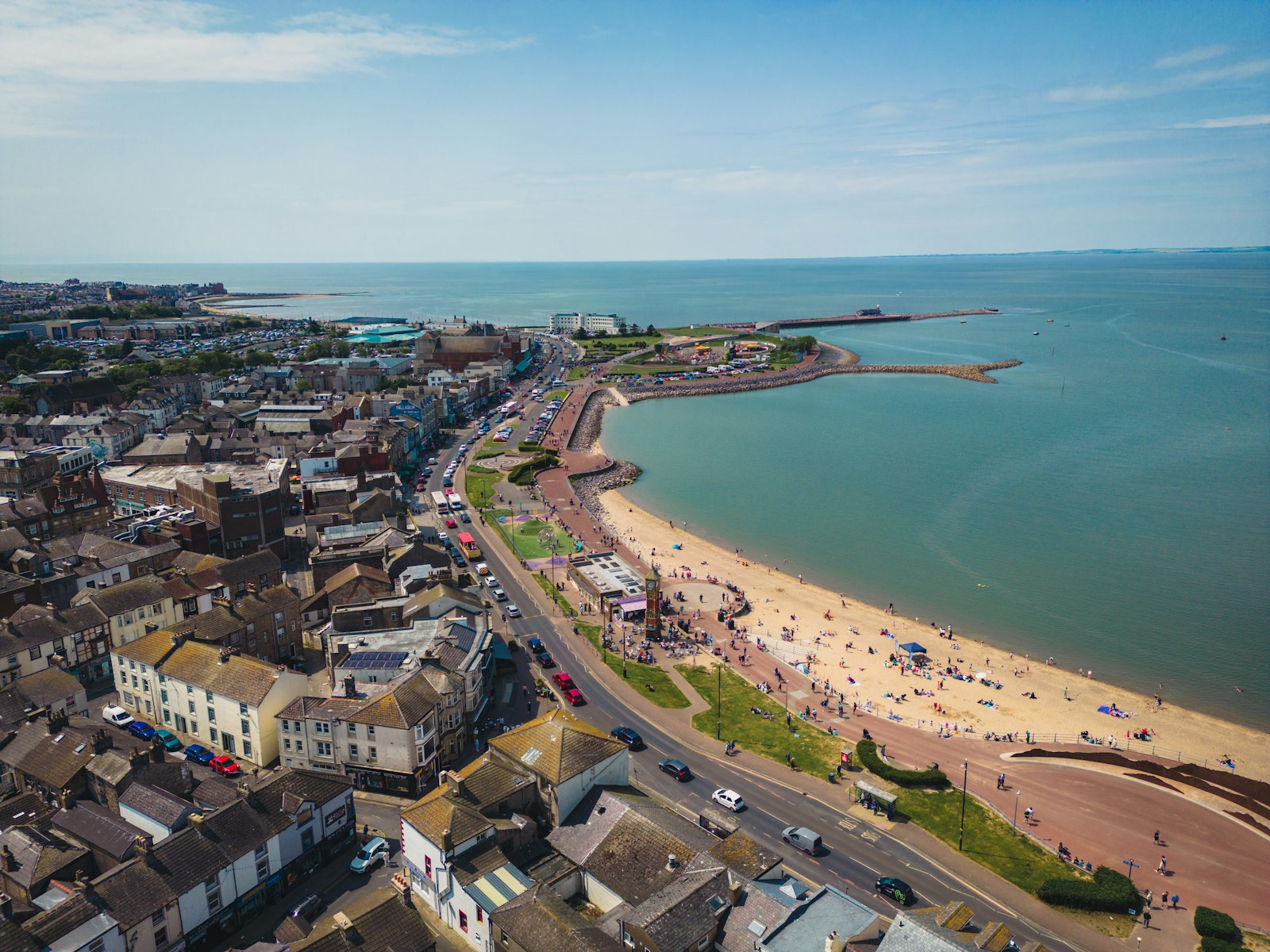 a bird's eye view of a beach and a city